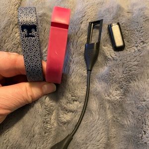 Fitbit Flex with Tory Burch band and a pink band